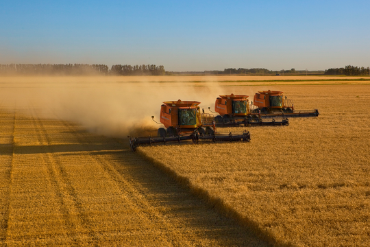 tractor harvesting farm
