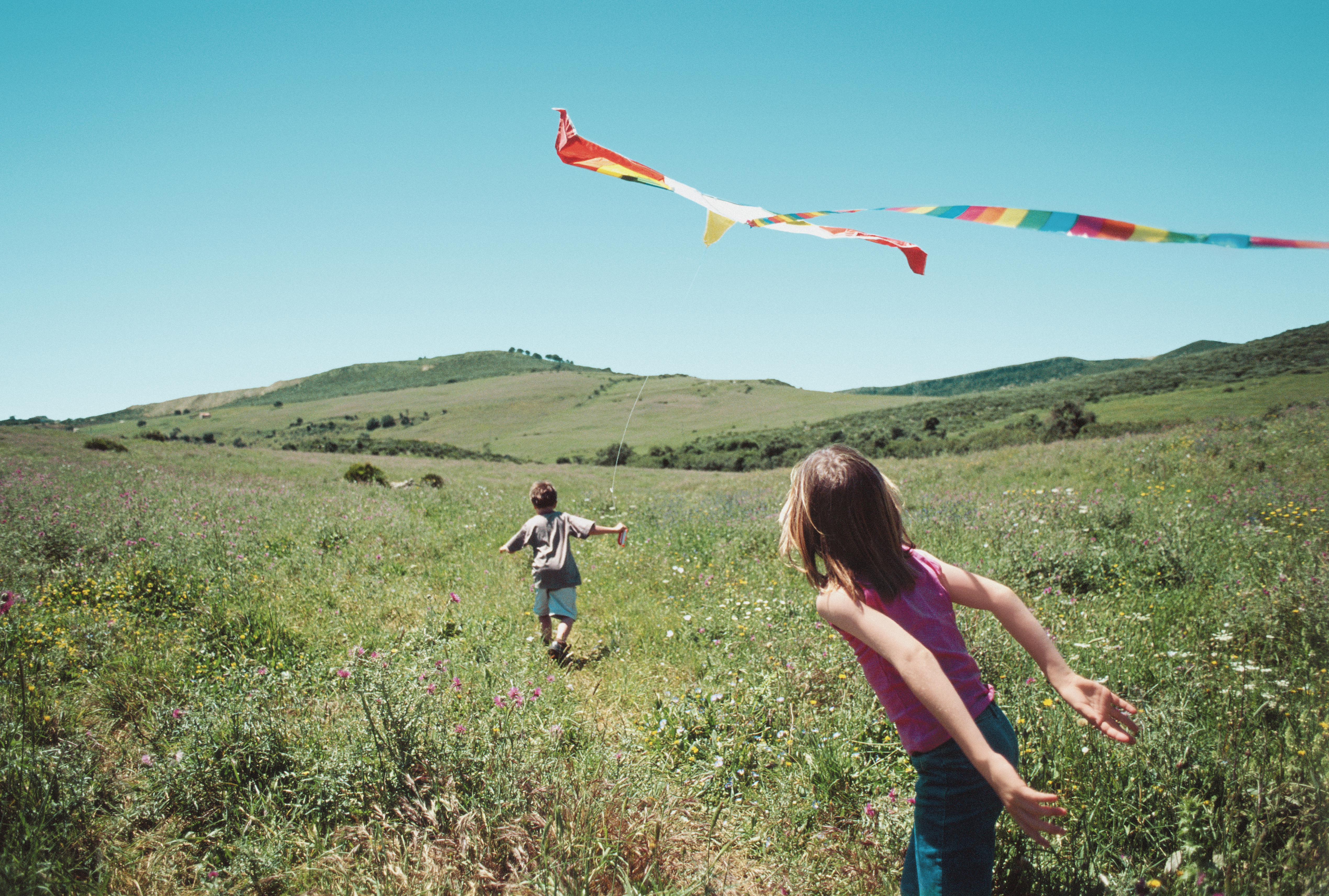 kids-playing-with-kite-gettyimages-522904060.jpg