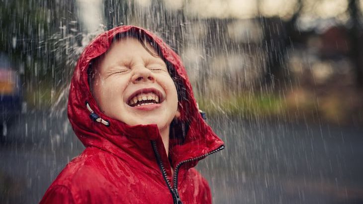 Boy-smiling-rain.jpg